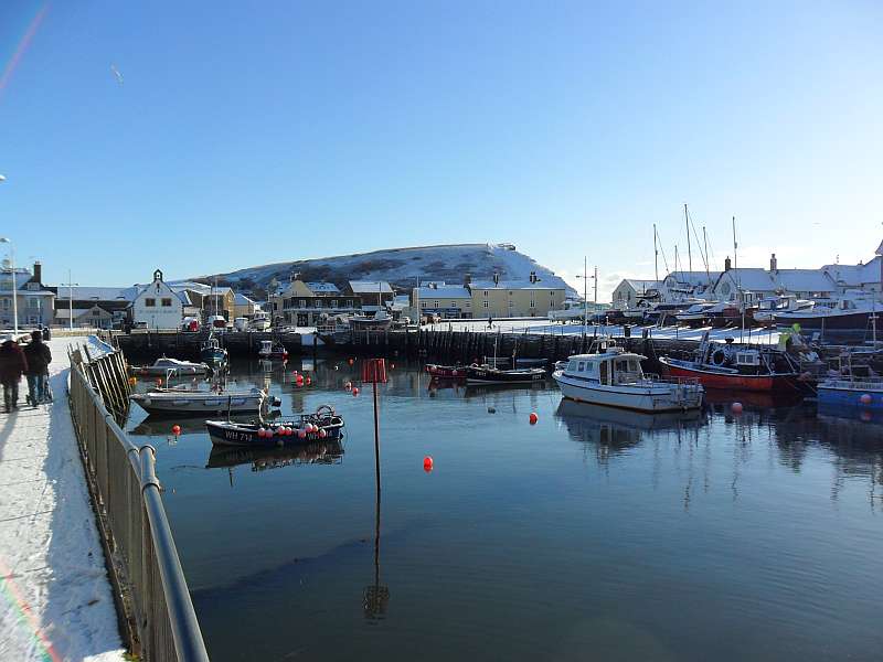 West Bay in the Snow, East Cliff from the Harbour